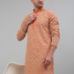 Men's Peach Embroidered Kurta with Pyjama.